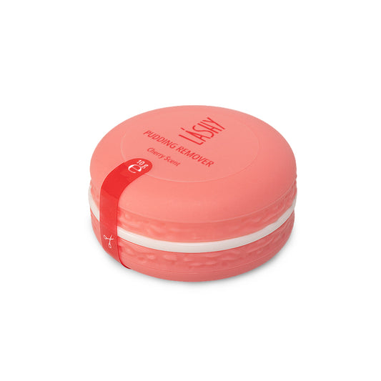 Barattolo chiuso a forma di macaron color rosa corallo contenente il Remover in crema LASHY Pudding al profumo di ciliegia (Cherry Scent).